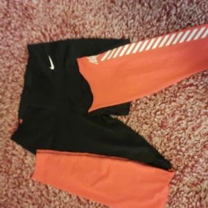 Nike leggings.  Mesh bottom from the knee down. Size small. Black and a pink.